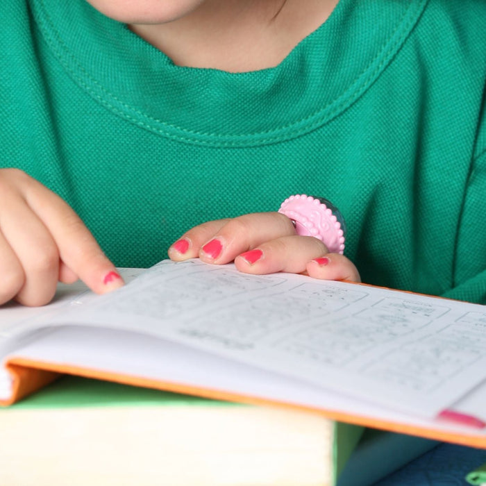 2 children reading a social story from a book