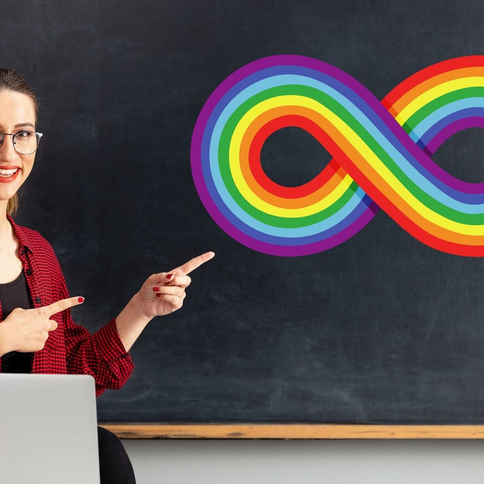 Teacher or professional pointing to an autism acceptance logo