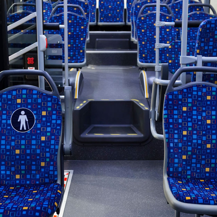 Empty city bus seats.