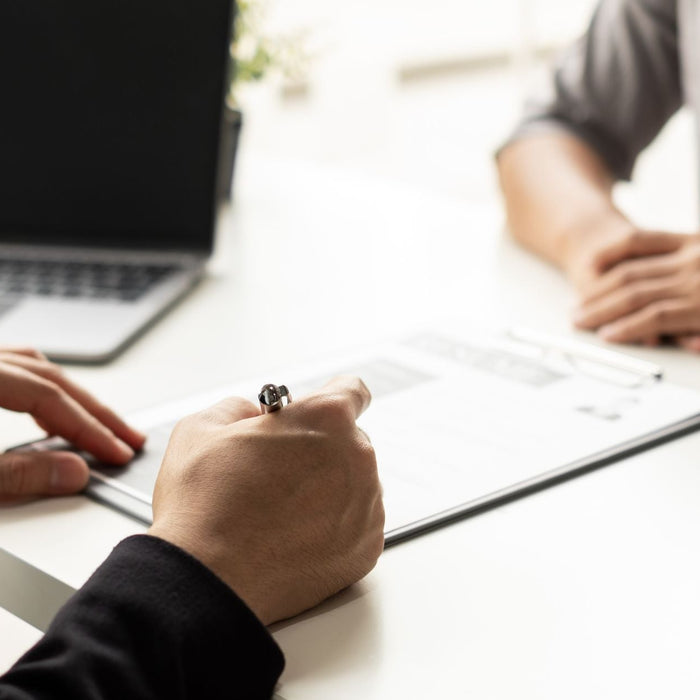 Student completing an an interview with their resume