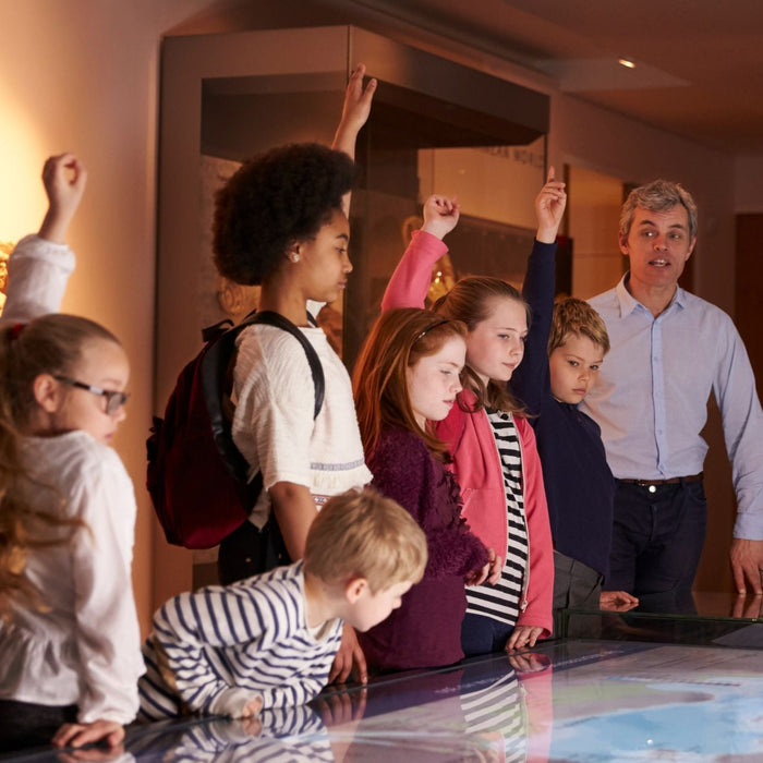Group of students with their teacher at a museum